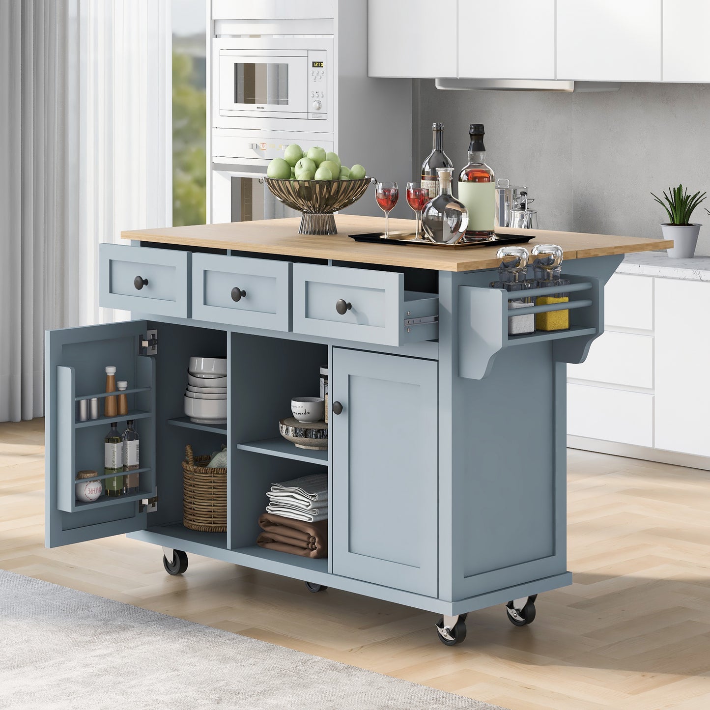 Kitchen handcart with rubber wood leaf countertop, storage cabinet, shelf, and 3 dining room drawers, gray blue