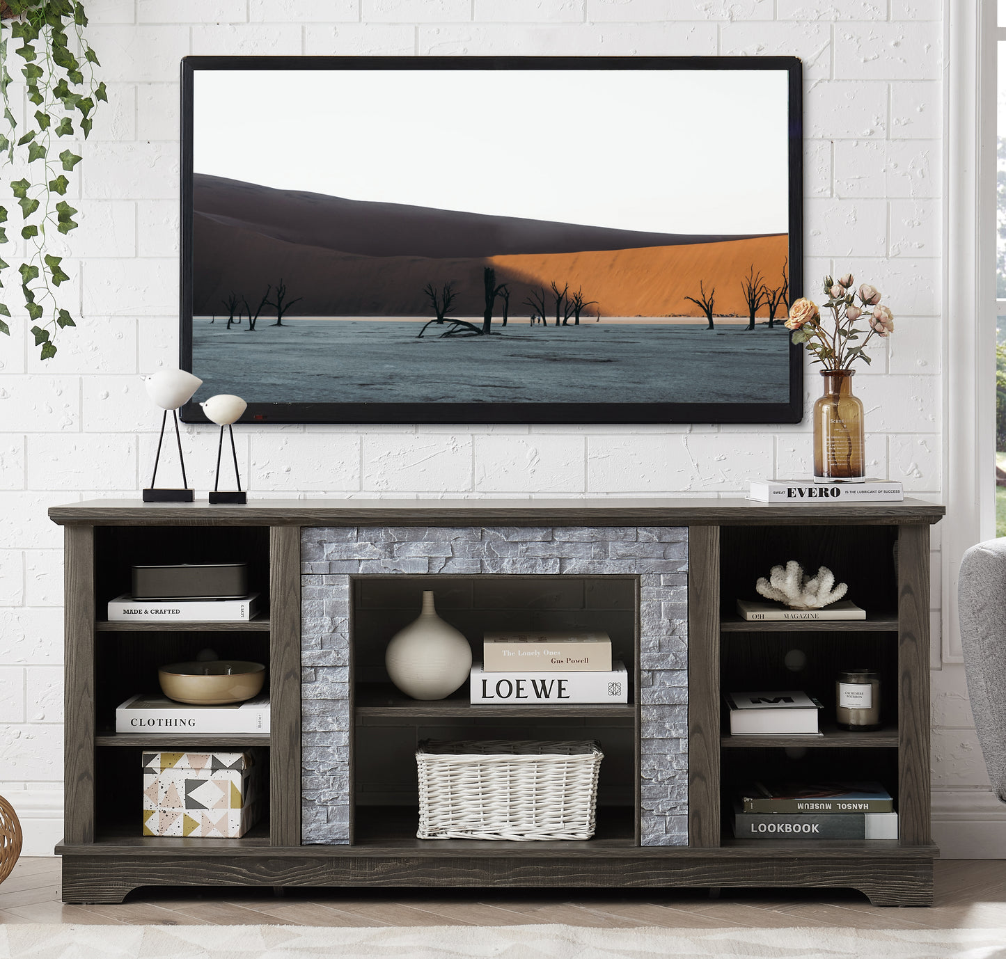 Mantel Stone modern entertainment console, manually stacked stone surrounds open storage space, gray